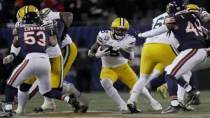 Green Bay Packers running back Josh Jacobs (8) finds a seam