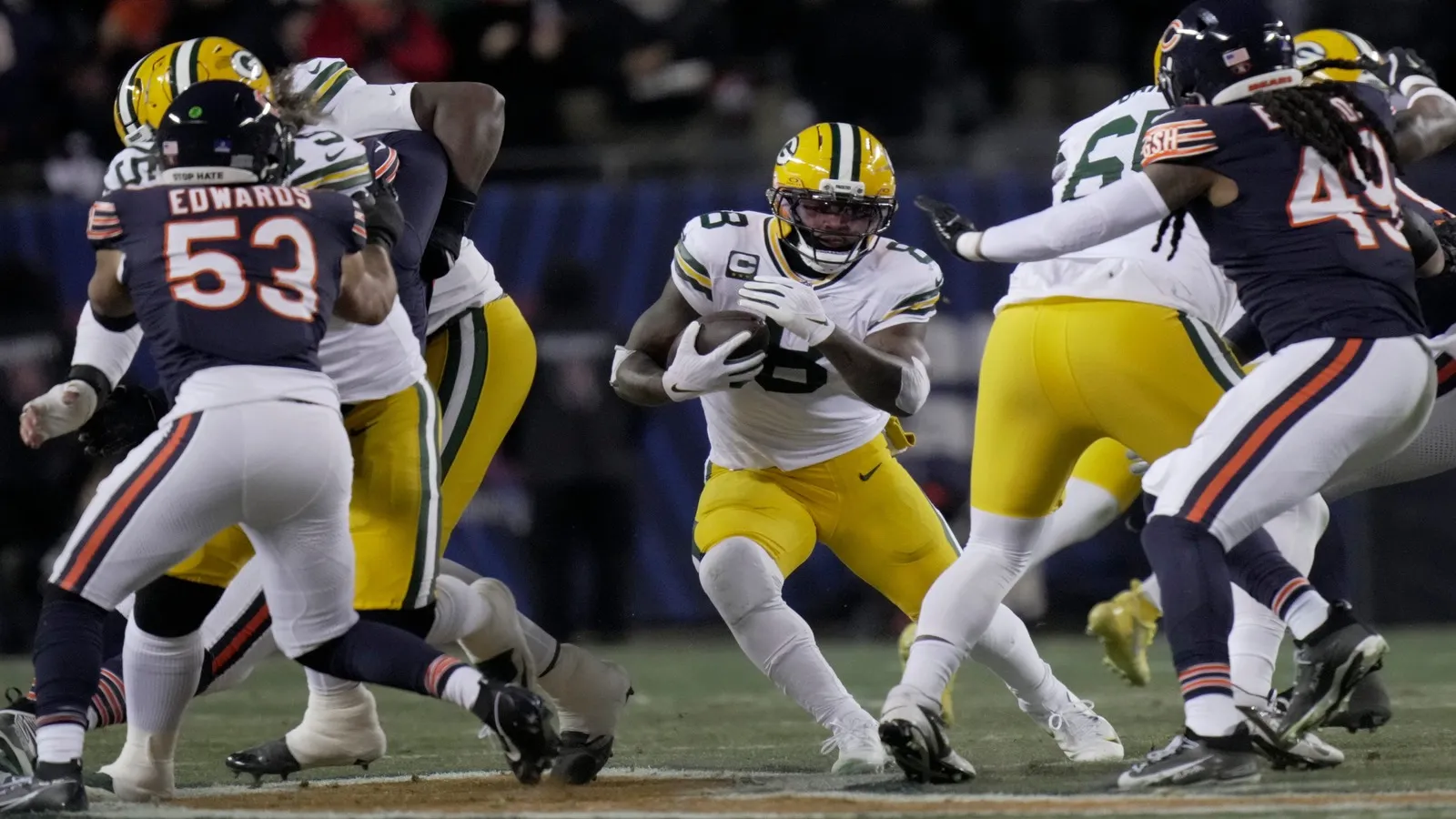 Green Bay Packers running back Josh Jacobs (8) finds a seam