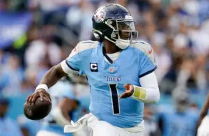 Tennessee Titans quarterback Cam Ward (1) looks for a receiver.