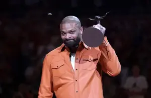 PJ Tucker is awarded the Texas Athletics Hall of Honor trophy.