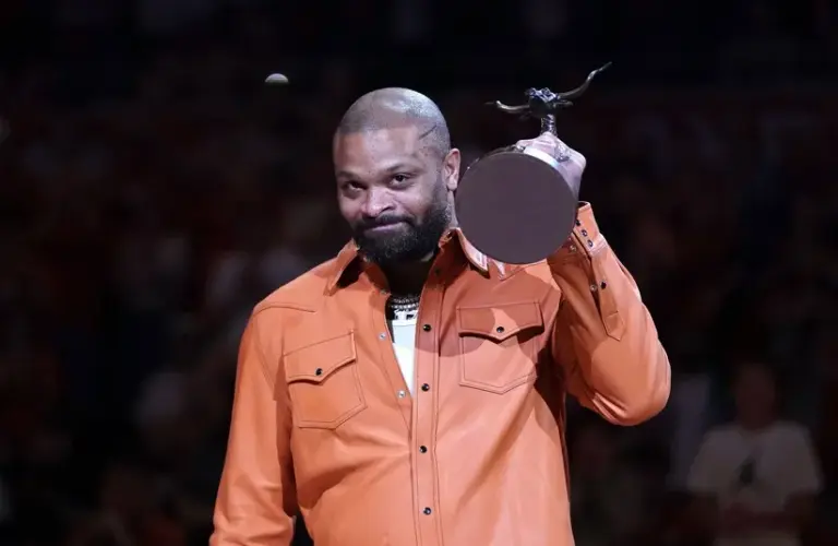 PJ Tucker is awarded the Texas Athletics Hall of Honor trophy.