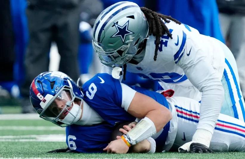 New York Giants quarterback Jaxson Dart (6) is tackled by Dallas Cowboys defensive end Jadeveon Clowney (42),