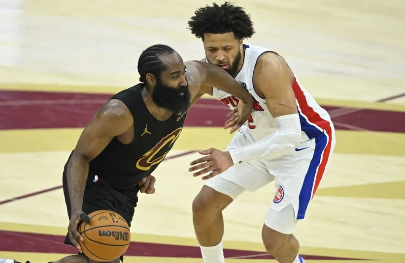 Cleveland Cavaliers guard James Harden (1) dribbles beside Detroit Pistons guard Cade Cunningham (2)