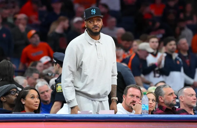 Hall of fame member Carmelo Anthony looks on.