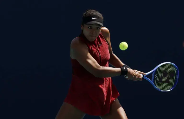 Naomi Osaka (JPN) hits a backhand.