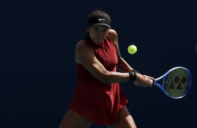 Naomi Osaka (JPN) hits a backhand.