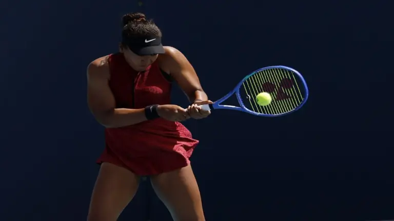 Naomi Osaka (JPN) hits a backhand.