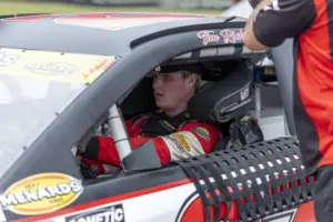 Apr 25, 2026; Talladega, Alabama, USA; ARCA Series driver Tim Richmond (27) checks out his car before the Alabama Manufactured Housing 200 ARCA Menards Series race at Talladega Superspeedway.