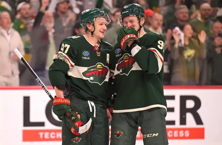 Minnesota Wild forward Kirill Kaprizov (97) and forward Vladimir Tarasenko (91) celebrate a series win.