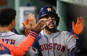 Houston Astros shortstop Carlos Correa (1) reacts after hitting a solo home run.