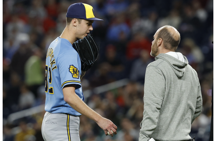 May 1, 2026; Washington, District of Columbia, USA; Milwaukee Brewers pitcher Jacob Misiorowski (32) talks with Brewers head trainer Brad Epstein (R) after an injury against the Washington Nationals during the sixth inning at Nationals Park. Mandatory Credit: Geoff Burke-Imagn Images