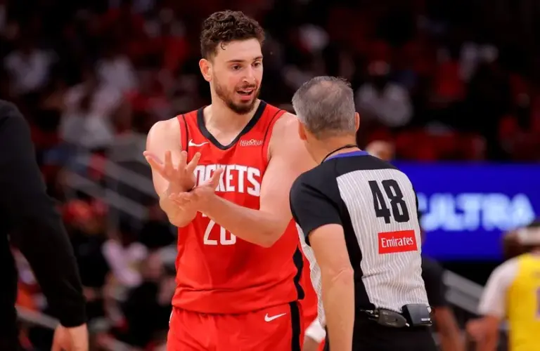 Houston Rockets center Alperen Sengun (28) talks with NBA referee Scott Foster (48).
