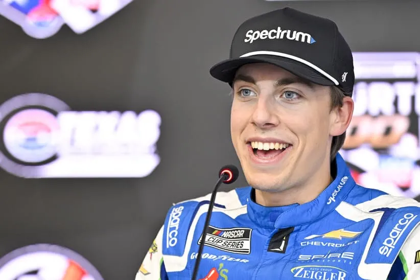 May 2, 2026; Fort Worth, Texas, USA; Spire Motorsports driver Carson Hocevar (77) is interviewed after winning the pole position in the qualifying session for the 2026 Wurth 400 Cup race at Texas Motor Speedway.