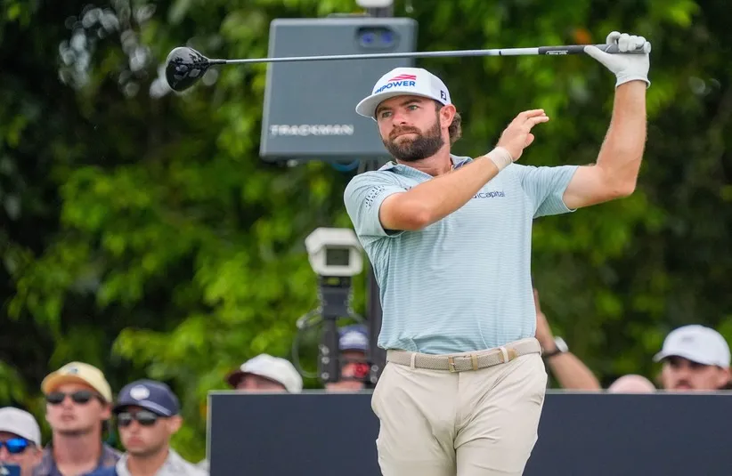 Cameron Young watches his tee shot on the 11th hole.