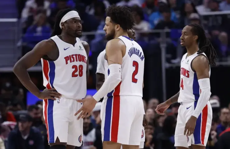 Detroit Pistons guard Cade Cunningham (2) talks to forward Isaiah Stewart (28).