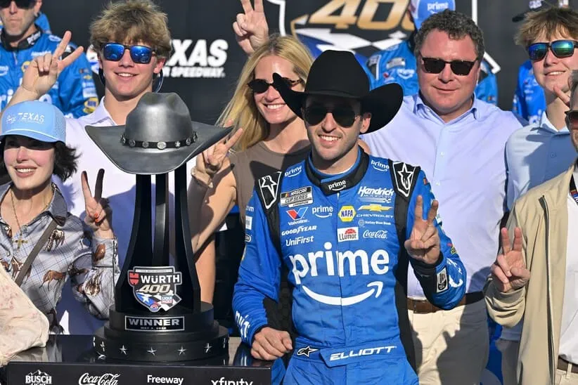 May 3, 2026; Fort Worth, Texas, USA; Hendrick Motorsports driver Chase Elliott (9) celebrates in victory lane with the trophy after he wins the 2026 Wurth 400 cup race at Texas Motor Speedway.