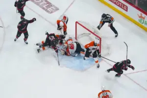 May 4, 2026; Raleigh, North Carolina, USA; Carolina Hurricanes left wing Taylor Hall (71) scores the game winning goal past Philadelphia Flyers goaltender Dan Vladar (80) and defenseman Travis Sanheim (6) during the first overtime in game two of the second round of the 2026 Stanley Cup Playoffs at Lenovo Center.