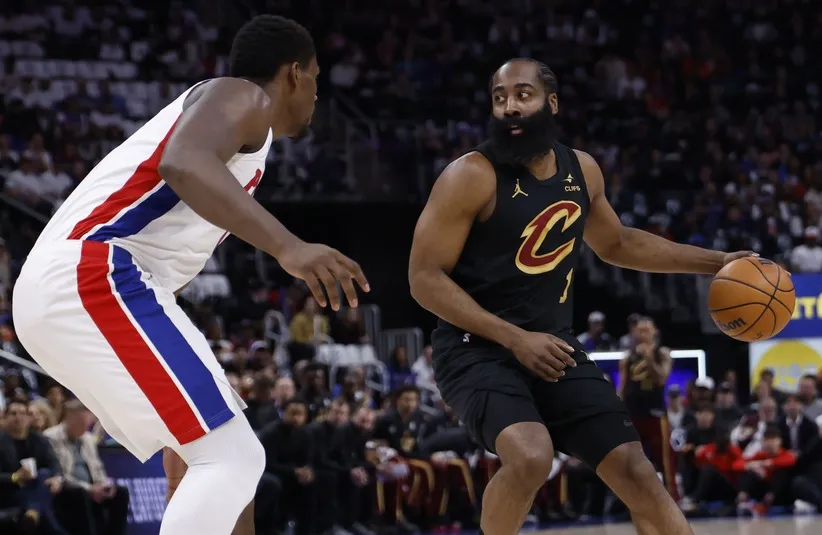 Cleveland Cavaliers guard James Harden (1) dribbles defended by Detroit Pistons center Jalen Duren (0).