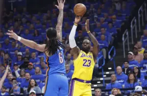 Los Angeles Lakers forward LeBron James (23) shoots as Oklahoma City Thunder forward Jaylin Williams (6) defends.