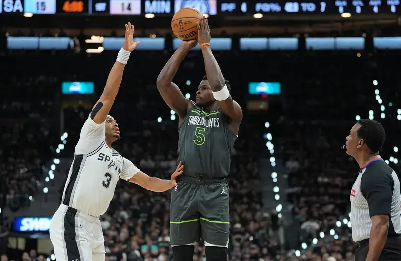 Minnesota Timberwolves guard Anthony Edwards (5) shoots over San Antonio Spurs forward Keldon Johnson (3) in the first half during game two of the second round of the 2026 NBA Playoffs at Frost Bank Center. Mandatory Credit: Daniel Dunn-Imagn Images