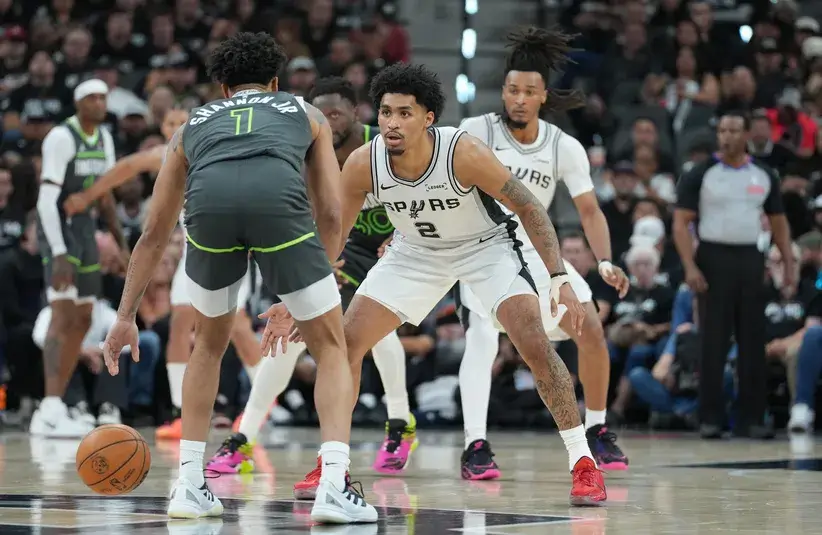San Antonio Spurs guard Dylan Harper (2) guards Minnesota Timberwolves guard Terrence Shannon Jr. (1) in the second half during game two of the second round of the 2026 NBA Playoffs.