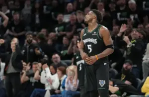 Minnesota Timberwolves guard Anthony Edwards (5) reacts to missing a shot.