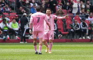 Inter Miami CF midfielder Rodrigo de Paul (7) scores a goal and celebrates with Inter Miami CF midfielder Lionel Messi (10).