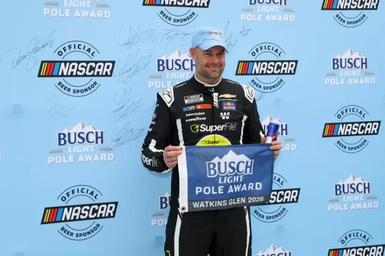 May 9, 2026; Watkins Glen, New York, USA; NASCAR Cup Series driver Shane Van Gisbergen stands with the Busch Light Pole Award after winning the pole for the Go Bowling at The Glen at Watkins Glen International.