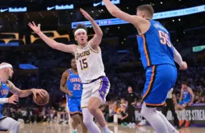Los Angeles Lakers guard Austin Reaves (15) reacts after not getting a foul call,