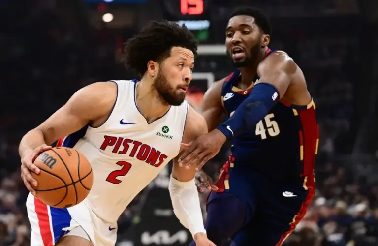 Detroit Pistons guard Cade Cunningham (2) drives to the basket against Cleveland Cavaliers guard Donovan Mitchell (45.)