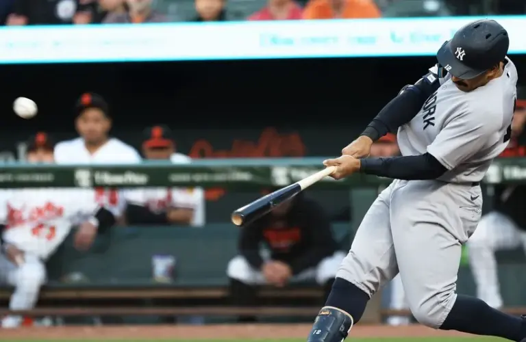 New York Yankees center fielder Trent Grisham (12) hits a home run.
