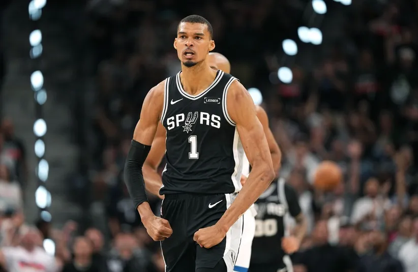 San Antonio Spurs forward Victor Wembanyama (1) reacts after scoring a three point basket.