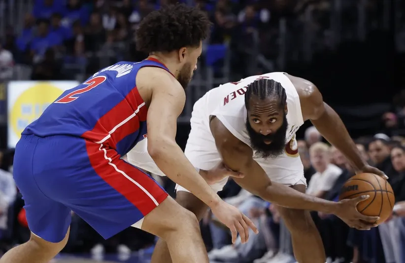 Cleveland Cavaliers guard James Harden (1) is defended by Detroit Pistons guard Cade Cunningham (2).