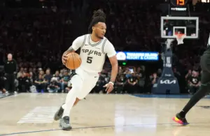 San Antonio Spurs guard Stephon Castle (5) dribbles the ball.