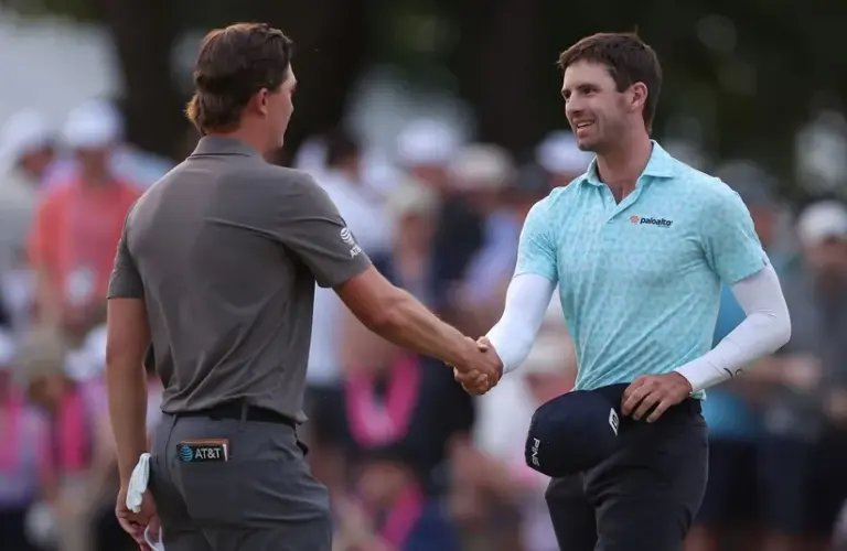 Alex Smalley reacts with Maverick McNealy on the 18th green during the third round of the PGA Championship.