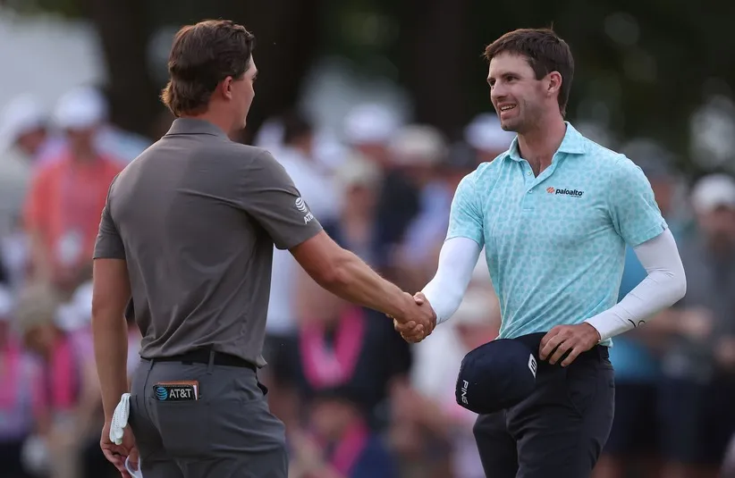 Alex Smalley reacts with Maverick McNealy on the 18th green during the third round of the PGA Championship.