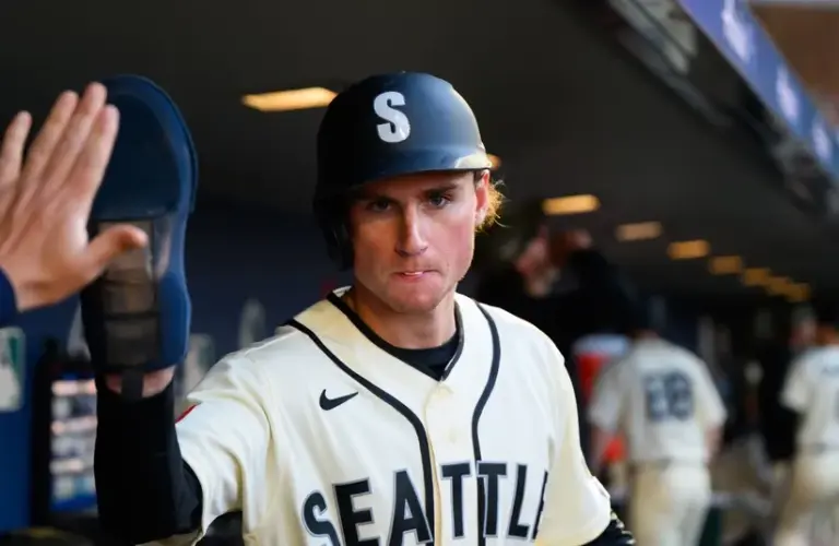 Seattle Mariners third baseman Colt Emerson (4) celebrates after scoring a run.