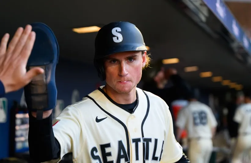 Seattle Mariners third baseman Colt Emerson (4) celebrates after scoring a run.