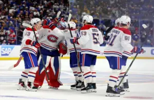 The Montréal Canadiens celebrate an overtime win over the Buffalo Sabres.