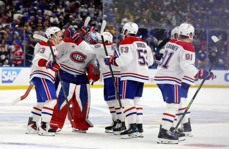 The Montréal Canadiens celebrate an overtime win over the Buffalo Sabres.