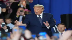 President Donald J. Trump is cheered by the crowd as he leaves a rally.