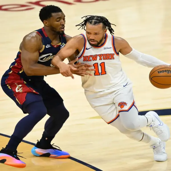 New York Knicks guard Jalen Brunson (11) moves the ball against Cleveland Cavaliers guard Donovan Mitchell (45).