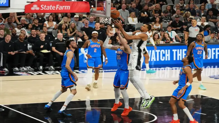 San Antonio Spurs center Victor Wembanyama (1) shoots while defended.