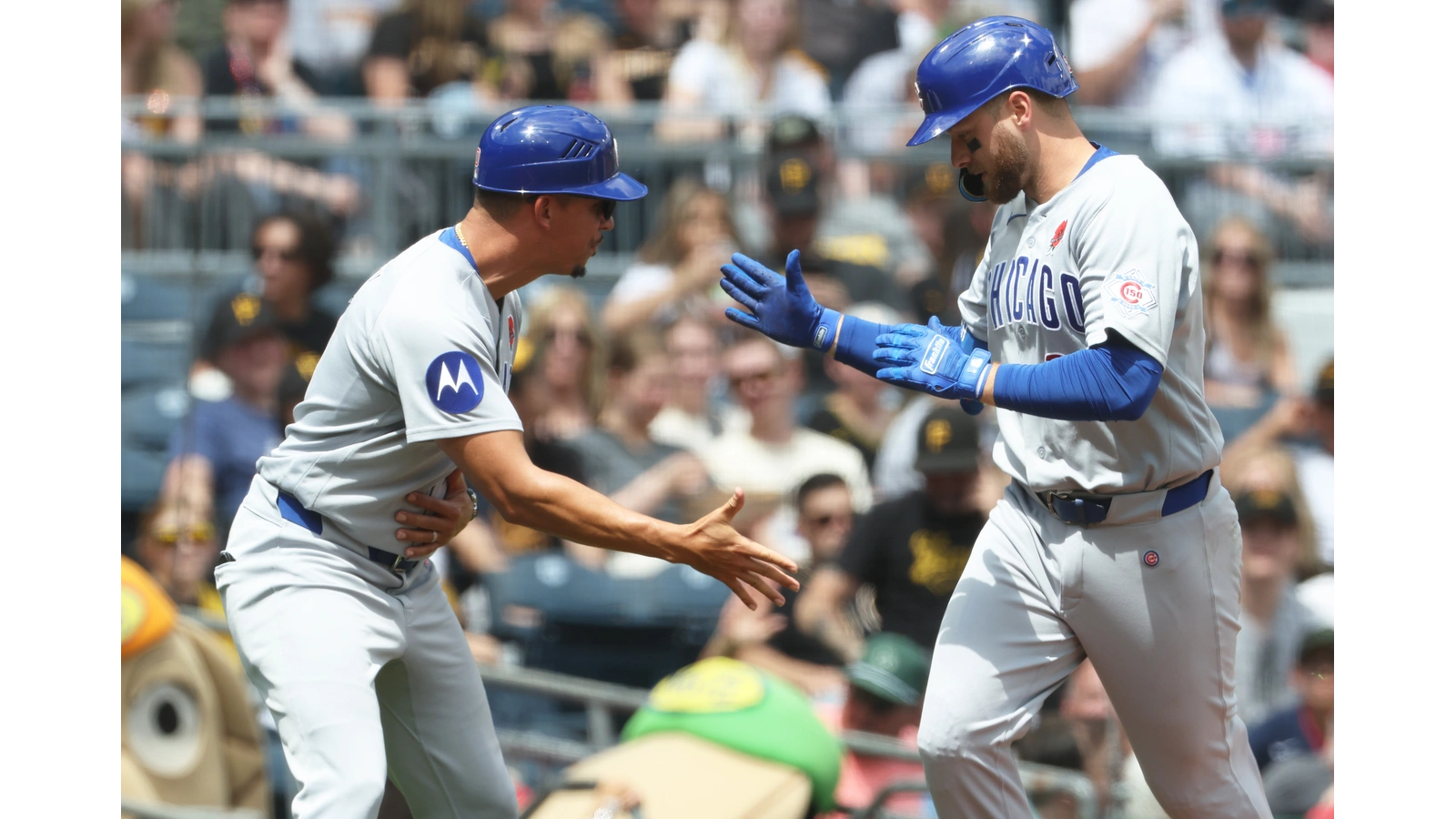 Cubs players celebrating in Pittsburgh