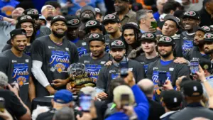 New York Knicks pose with the 2026 Eastern Conference trophy.