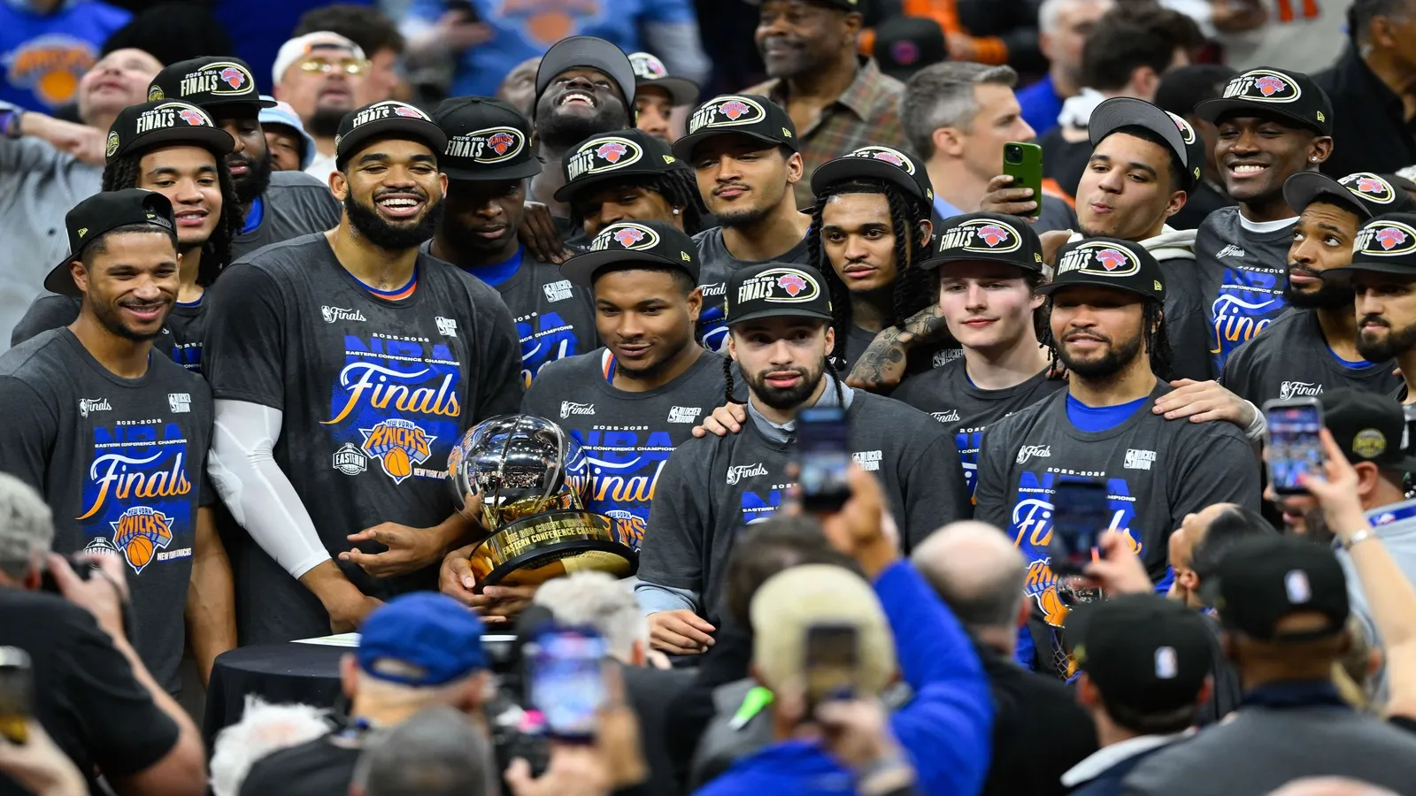New York Knicks pose with the 2026 Eastern Conference trophy.