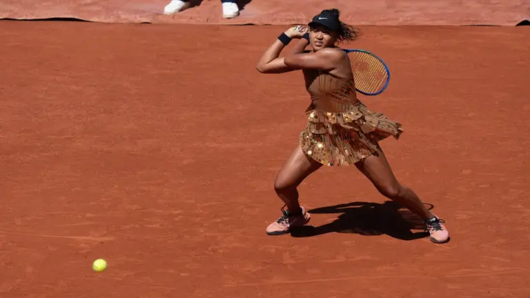 Naomi Osaka of Japan returns a shot during her match.