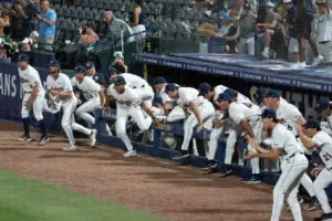Auburn Tigers dugout takes the field after victory as Auburn Tigers take on LSU Tigers during the SEC baseball tournament at Hoover Metropolitan Stadium in Hoover, Ala. on Wednesday, May 20, 2026. Auburn Tigers defeated LSU Tigers 3-1 in the SEC baseball tournament.