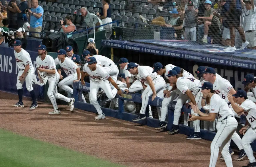 Auburn Tigers dugout takes the field after victory as Auburn Tigers take on LSU Tigers during the SEC baseball tournament at Hoover Metropolitan Stadium in Hoover, Ala. on Wednesday, May 20, 2026. Auburn Tigers defeated LSU Tigers 3-1 in the SEC baseball tournament.