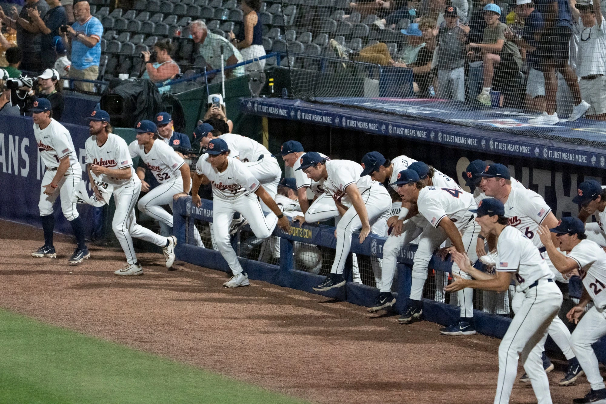Auburn Tigers dugout takes the field after victory as Auburn Tigers take on LSU Tigers during the SEC baseball tournament at Hoover Metropolitan Stadium in Hoover, Ala. on Wednesday, May 20, 2026. Auburn Tigers defeated LSU Tigers 3-1 in the SEC baseball tournament.